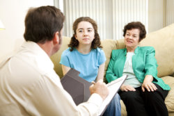 girl with her mother in a therapy session