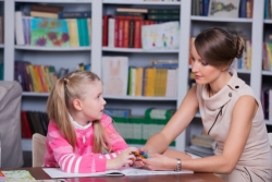 child psychologist counseling a little girl