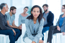 female in a group therapy session