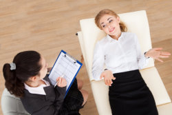female in a bed while on a therapy session